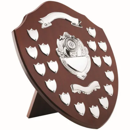MAHOGANY SHIELD WITH CHROME FRONTS AND 17 RECORD SHIELDS (1in CENTRE) - 16in